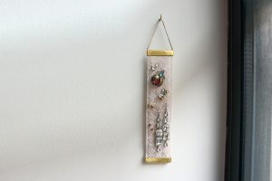 Porte-boucles d'oreilles mural